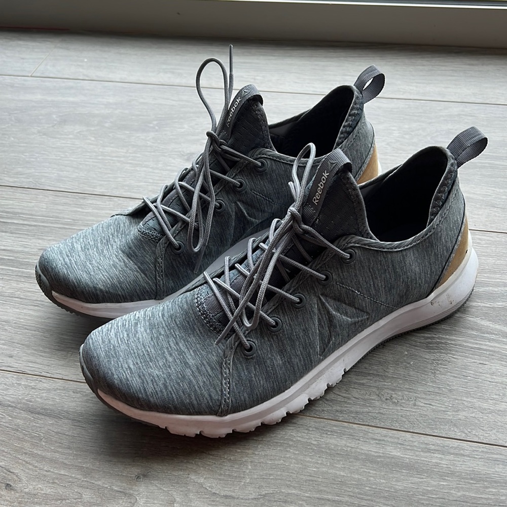 Size 10 grey Reebok sneaker with brown leather accent